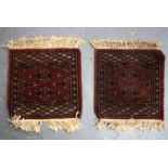 A PAIR OF TEKKE TURKMEN RUGS, decorated with geometric design. 40 cm x 32 cm.