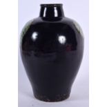 A CHINESE AUBERGINE GLAZED PORCELAIN VASE, decorated with twin green leaves. 23 cm high.
