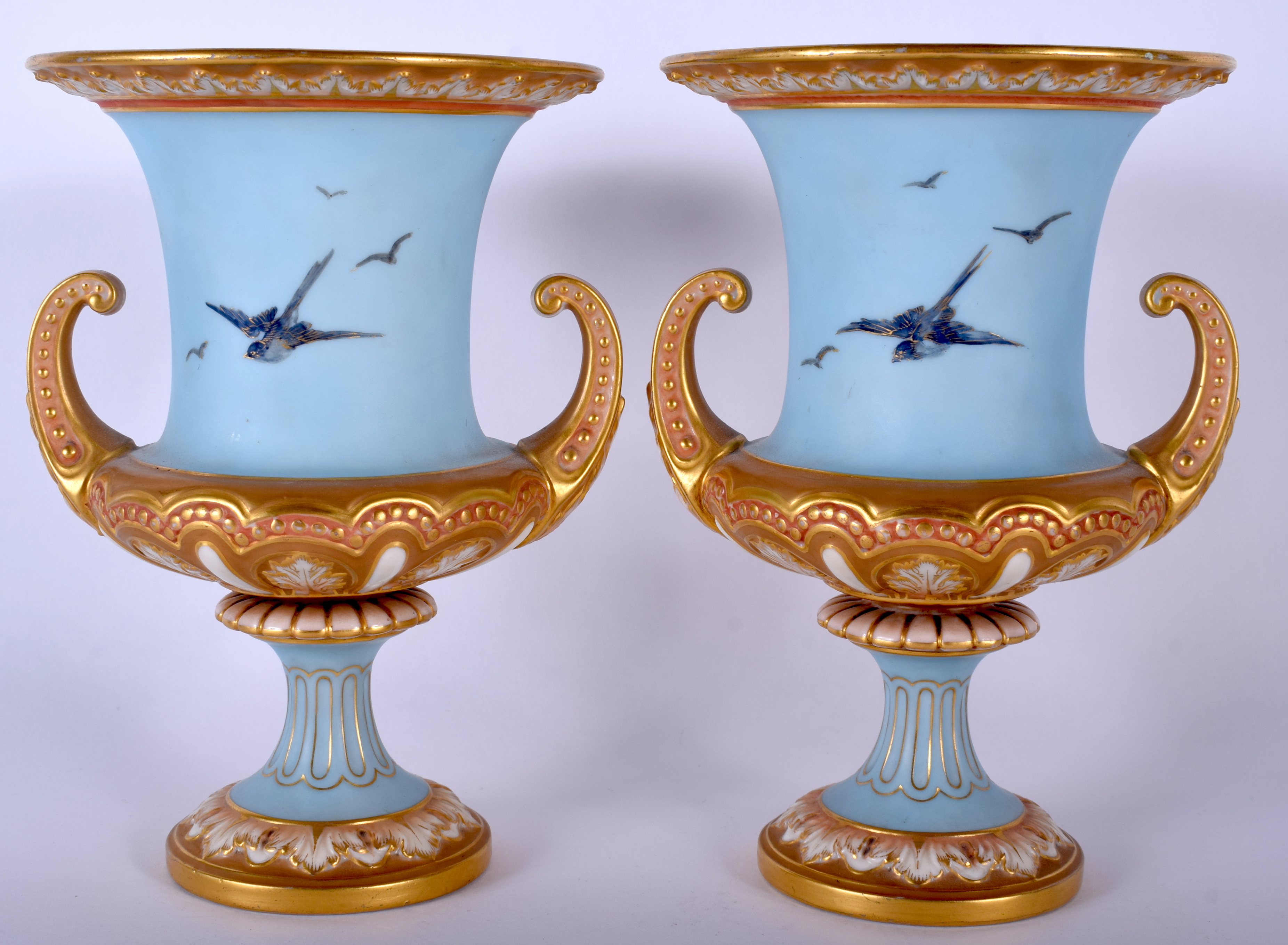 A PAIR OF ROYAL WORCESTER TWIN HANDLED PORCELAIN URN VASES by Charles Baldwyn, painted with swans. - Image 2 of 3