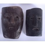 TWO UNUSUAL VINTAGE TRIBAL CARVED WOODEN MASKS possibly Arctic, Eskimo. Largest 29 cm x 20 cm. (2)