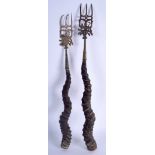 A PAIR OF 19TH CENTURY MIDDLE EASTERN HORN AND BRASS TOASTING FORKS decorated with Buddhistic figur