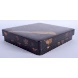 A 19TH CENTURY JAPANESE MEIJI PERIOD BLACK LACQUER WRITING BOX AND COVER decorated with fans and fl