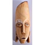 AN UNUSUAL EARLY 20TH CENTURY AFRICAN IVORY BONE MASK. 12 cm x 4 cm.