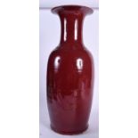 A LARGE CHINESE QING DYNASTY OX BLOOD GLAZED PORCELAIN VASE, formed with a flared rim. 54.5 cm high