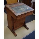 AN ANTIQUE PINE DAVENPORT, formed with a leather writing slope. 84 cm x 61 cm.