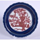 A CHINESE QING DYNASTY BLUE GROUND PORCELAIN DISH BEARING XUANDE MARKS, painted with iron red folia