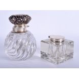 AN ANTIQUE SILVER INKWELL London 1908, together with another silver topped inkwell. 7 cm & 12 cm hi