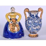 A 19TH CENTURY MAJOLICA POTTERY FIGURAL BELL, together with a twin handled urn 12 cm high. (2)