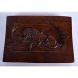 AN 18TH CENTURY CONTINENTAL CARVED FRUITWOOD PLAQUE carved with a recumbent lion. 17.5 cm x 12.5 cm