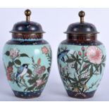 A PAIR OF 19TH CENTURY JAPANESE MEIJI PERIOD CLOISONNE ENAMEL VASES AND COVERS decorated with birds