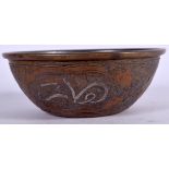 AN ISLAMIC BRONZE BOWL, decorated with script and silver inlay. 12.5 cm wide.