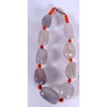 AN AGATE BOULDER NECKLACE, formed with red coral spacers. 42 cm long.