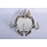 AN ANTIQUE GERMAN PORCELAIN MIRROR with triple sconces. 40 cm x 38 cm.