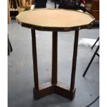 A STYLISH ARTS & CRAFTS HAMMERED BRASS TOP TABLE, twelve sided with wooden column supports. 64 cm x