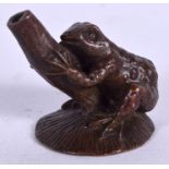 A JAPANESE BRONZE OKIMONO IN THE FORM A TOAD, MODELLED UPON A LILY PAD, signed. 3.2 cm high.