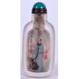 A CHINESE REVERSE PAINTED SNUFF BOTTLE, painted with scholars in landscapes. 8 cm high.