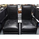 A STYLISH PAIR OF 1980'S BLACK OAK ARM CHAIR, formed with studded leather folding back rest. 96.5 c