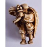 A 19TH CENTURY JAPANESE MEIJI PERIOD CARVED IVORY NETSUKE modelled as a boy wearing mask. 4.5 cm x