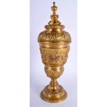 A 19TH CENTURY GILT BRONZE GOBLET AND COVER formed with fish, figures and mask heads. 30 cm high.