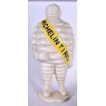 A LARGE CAST IRON MICHELIN MAN DOOR STOP, “Michelin Tires”. 57 cm high.