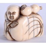 AN EARLY 19TH CENTURY JAPANESE EDO PERIOD CARVED IVORY NETSUKE. 4 cm x 2.75 cm.