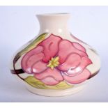 A MOORCROFT VASE Hibiscus pattern. 12.5 cm high.