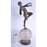 A RARE ART DECO SPELTER AND MARBLE FIGURAL LAMP modelled standing upon a facetted orb. 49 cm high.