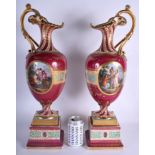 A VERY LARGE PAIR OF ANTIQUE ROYAL VIENNA PORCELAIN PEDESTAL EWERS painted with classical scenes. 5