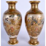 A PAIR OF 19TH CENTURY JAPANESE MEIJI PERIOD SATSUMA VASES painted with warriors. 23.5 cm high.
