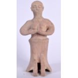 A CENTRAL ASIAN CLAY FIGURE OF A STANDING MALE, modelled in incised robes. 28 cm high.