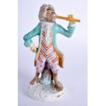 A 19TH CENTURY MEISSEN PORCELAIN FIGURE OF A MONEY MUSICIAN playing a brown pipe. 14 cm high.