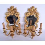 A PAIR OF 19TH CENTURY FRENCH ORMOLU WALL SCONCE MIRRORS decorated with figures and foliage. 40 cm