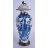A 19TH CENTURY CHINESE BLUE AND WHITE VASE AND COVER painted with figures. 27 cm high.