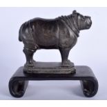 A RARE 16TH/17TH CENTURY CHINESE INDIAN CARVED STONE RHINOCEROS modelled upon a canted base. 13 cm