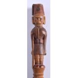 A LARGE EARLY 20TH CENTURY AFRICAN TRIBAL COLONIAL HARDWOOD STAFF modelled as a male wearing a red