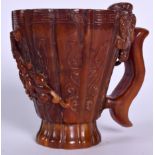 A LARGE CHINESE HORN LIBATION CUP, carved in relief with chilong and Greek key banding. 14 cm x 15