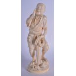 A 19TH CENTURY JAPANESE MEIJI PERIOD CARVED IVORY OKIMONO modelled holding a net. 18 cm high.