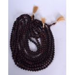 A GROUP OF FIVE CHINESE WOODEN PRAYER NECKLACE, formed with spherical beads. 90 cm long. (5)