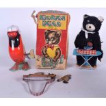 A BOXED JAPANESE TINPLATE WIND UP IRONING BEAR, together with a clockwork bird and another tinplate
