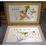 A PAIR OF MID/LATE 20TH CENTURY CHINESE FRAMED SILK PANELS, depicting exotic birds. 35 cm x 58 cm.
