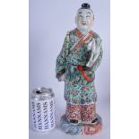 AN EARLY 20TH CENTURY CHINESE FAMILLE ROSE PORCELAIN FIGURE Late Qing, painted with flowers. 36 cm