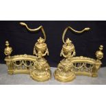 A PAIR OF ANTIQUE FRENCH BRONZE FIRE DOGS with floral wreaths and lion mask heads. 51 cm x 43 cm.