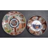 A JAPANESE KUTANI PORCELAIN CHARGER, together with an imari dish. Largest 41 cm. (2)