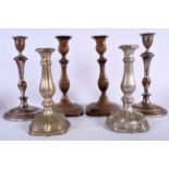 A SET OF THREE ANTIQUE PLATED CANDLESTICKS, varying form. Largest 30 cm. (6)