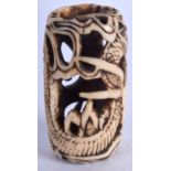 AN 18TH CENTURY JAPANESE EDO PERIOD CARVED IVORY TOGGLE carved with a dragon. 3.75 cm x 2.5 cm.