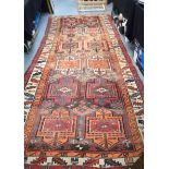 A 19TH CENTURY CAUCASIAN SHAHSAVAN TRIBAL LONG PILE RUG, decorated with geometric motifs. 340 cm x