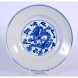 A CHINESE BLUE AND WHITE DISH GUANGXU MARK AND PERIOD, painted with a dragon in flight amongst the