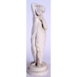 A LARGE PARIAN FIGURINE OF A SEMI NUDE FEMALE, formed in flowing robes with one breast exposed. 35.