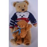 A VINTAGE STUFFED TEDDY BEAR, together with a smaller example. Largest 54 cm. (2)