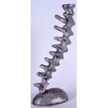 MICHAEL ARAM (20th century American) RARE CANDLESTICK SCULPTURE, cast metal and formed as a spinal